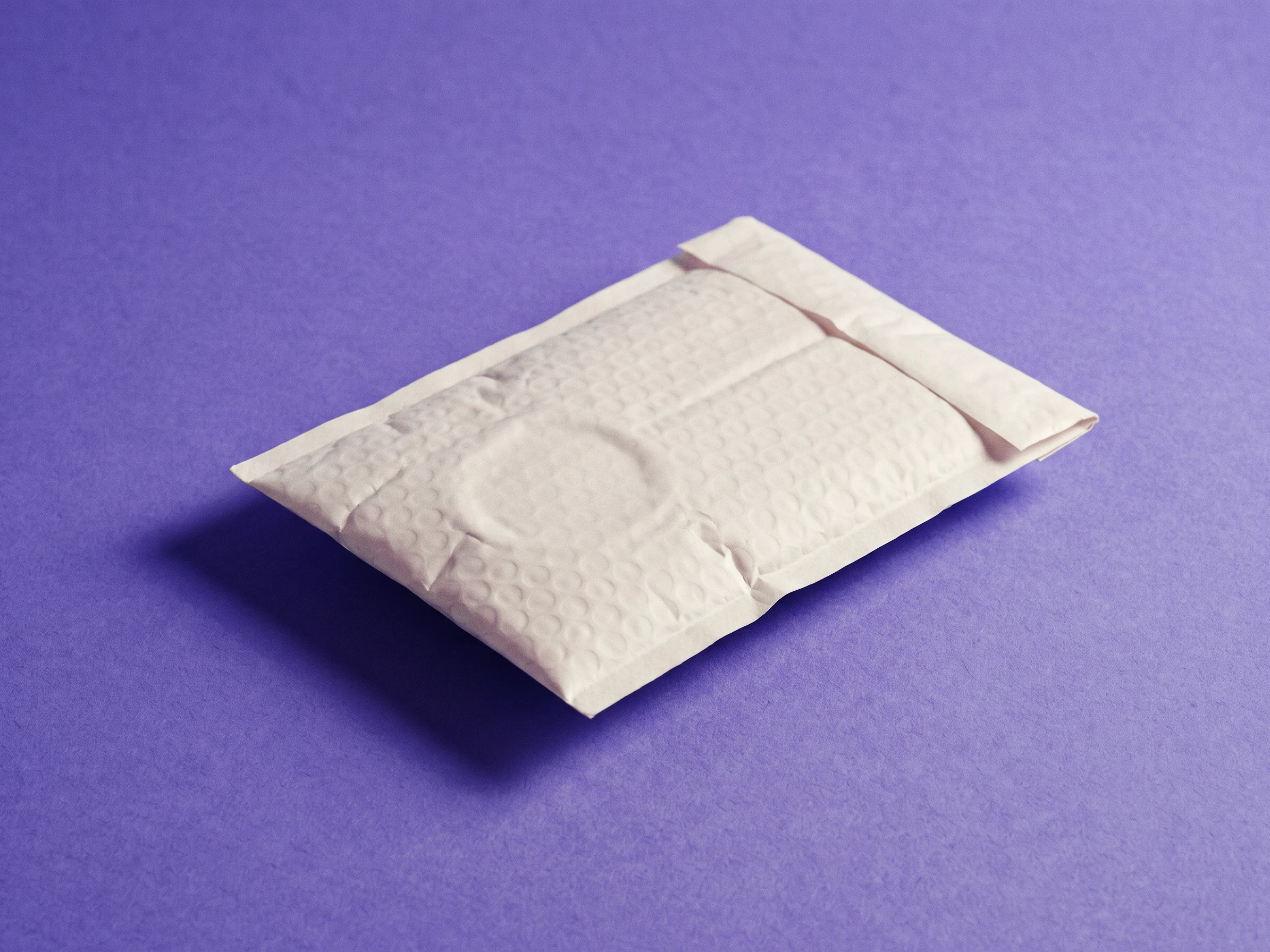 A sealed unbranded padded mailer on iris seamless paper