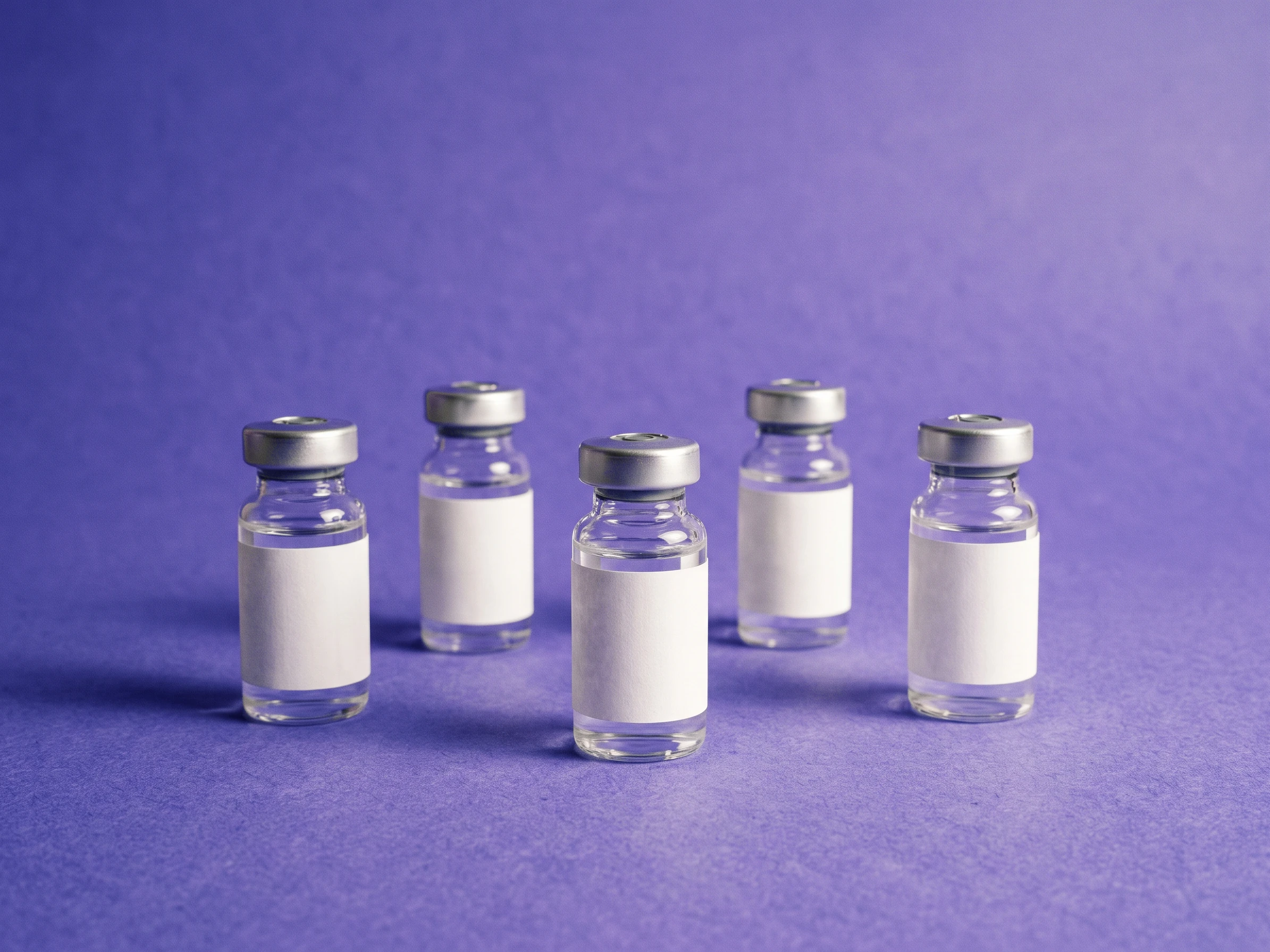 Five unlabelled vials standing on iris seamless paper