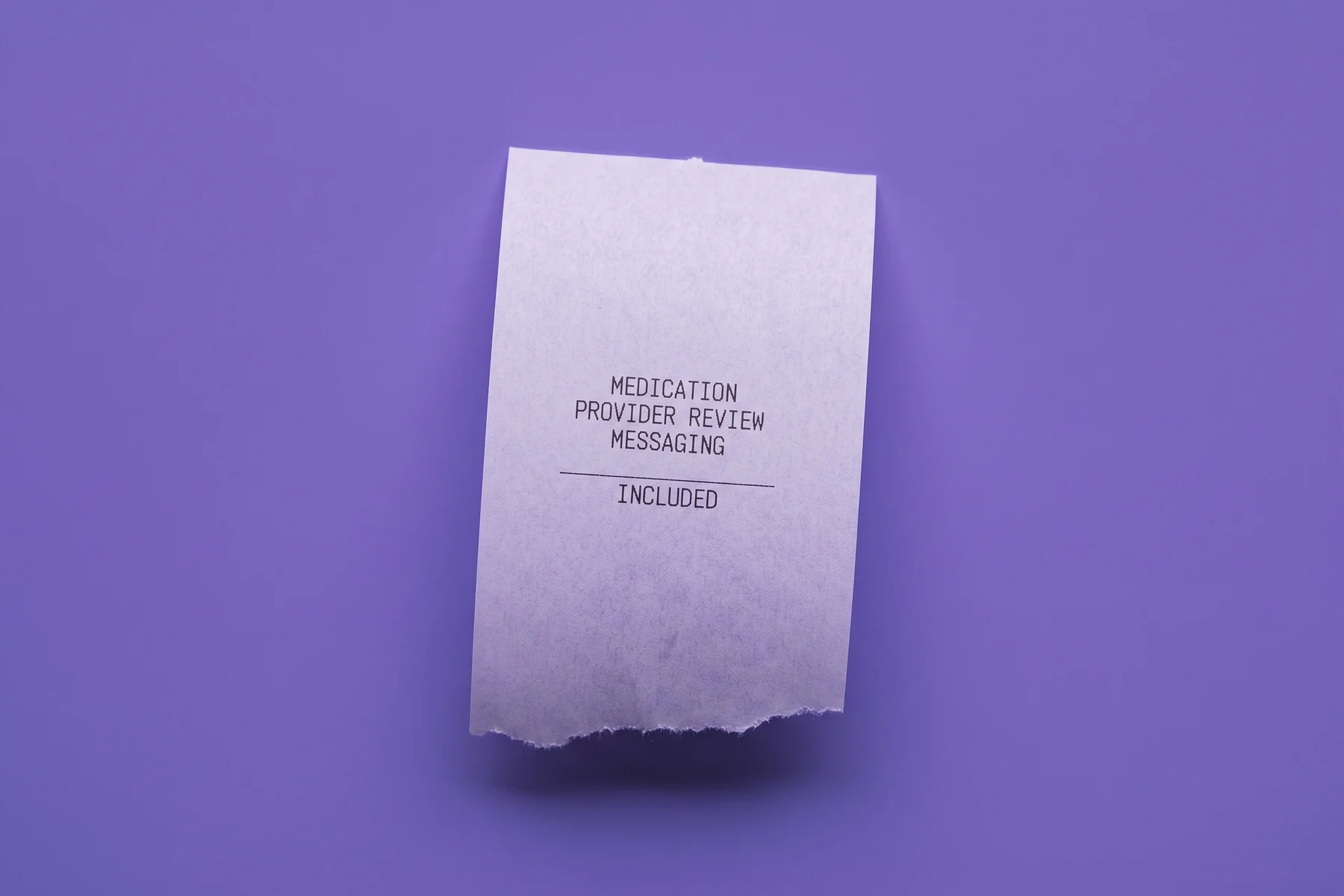 A paper receipt on iris paper listing medication, provider review and messaging as included